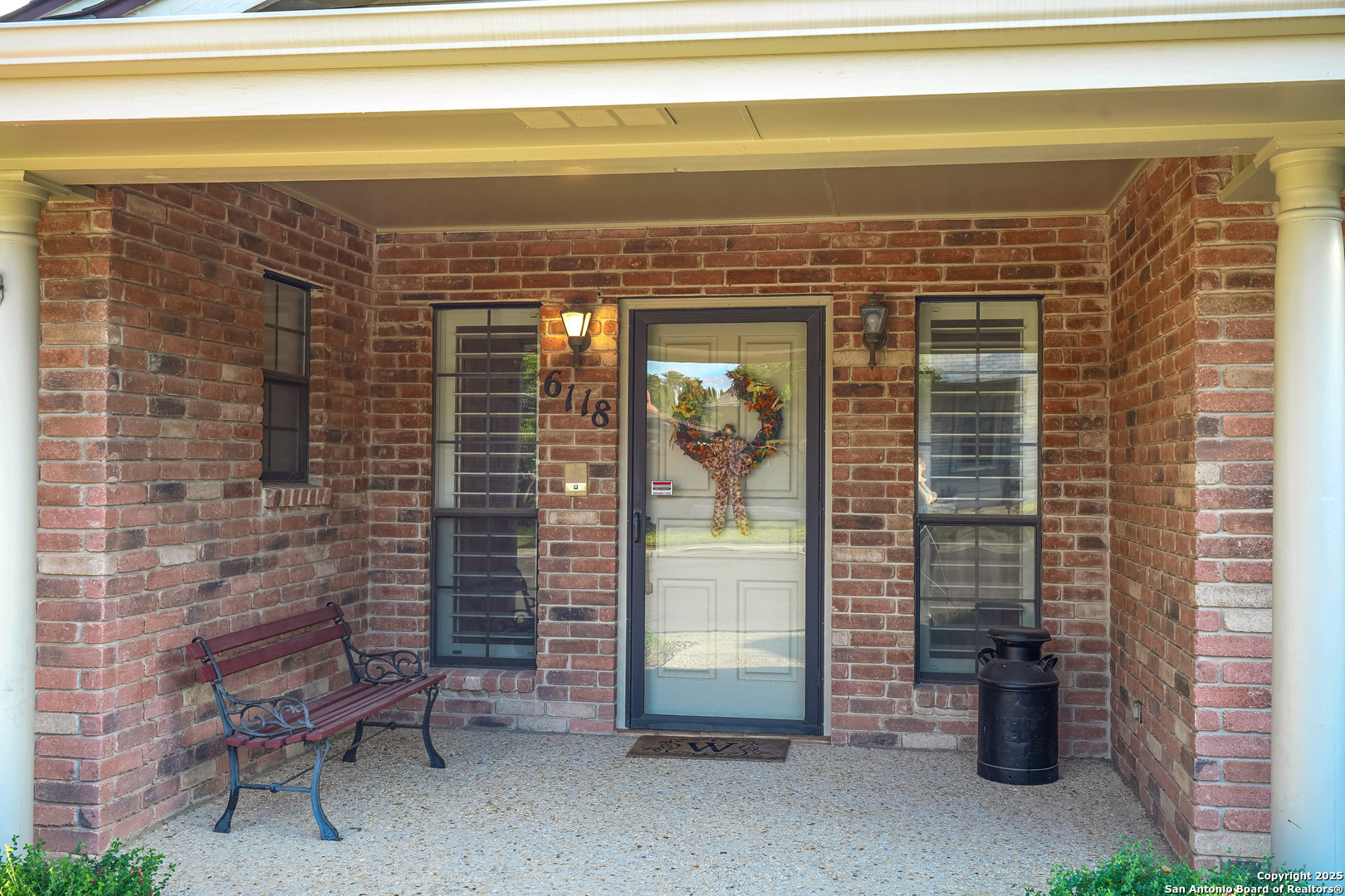 6118 Crescent Falls Windcrest, TX 78239 - Photo 8 of 60 a view of a door and chair and fire pit in front of door