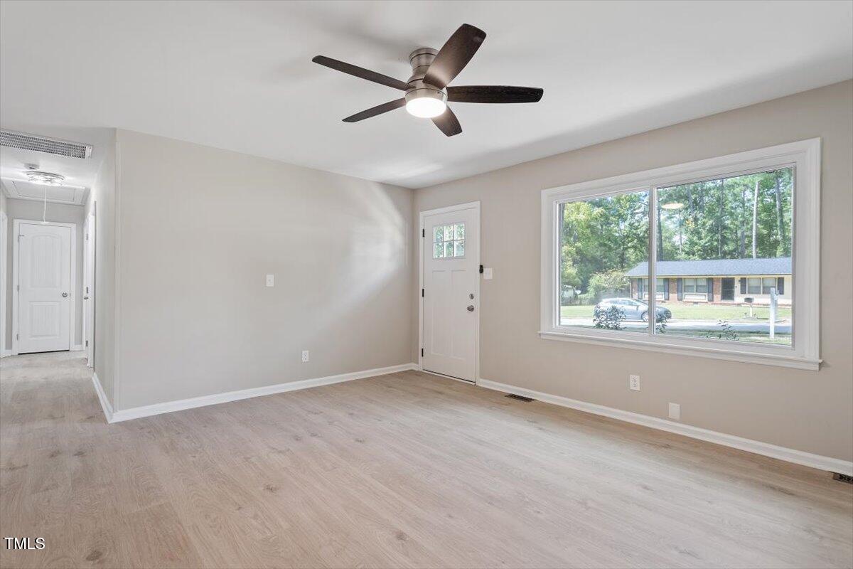 507 Forest Ridge Road Garner, NC 27529 - Photo 15 of 33 a view of an empty room with a window
