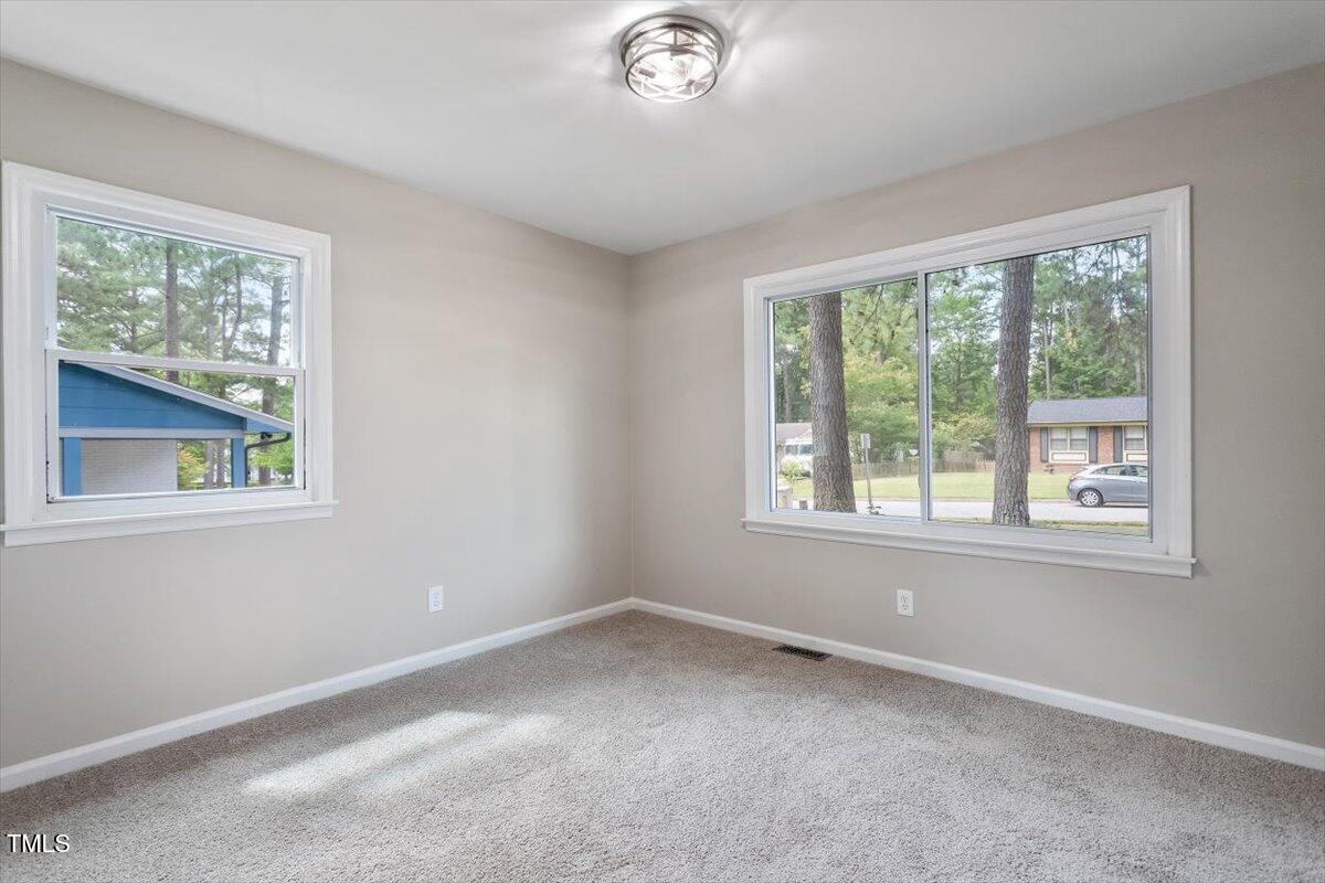 507 Forest Ridge Road Garner, NC 27529 - Photo 19 of 33 an empty room with a window
