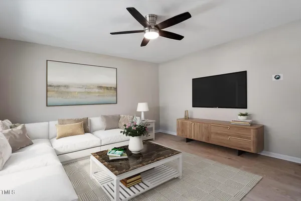a living room with furniture and a flat screen tv