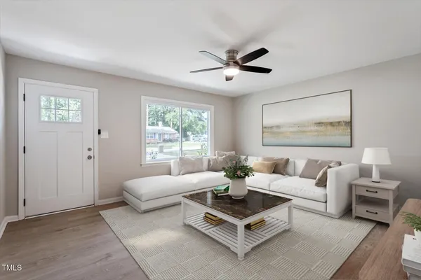 a living room with furniture and a large window