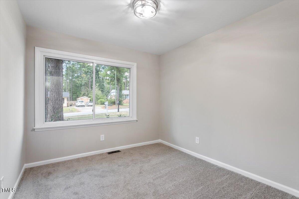 507 Forest Ridge Road Garner, NC 27529 - Photo 21 of 33 an empty room with a window