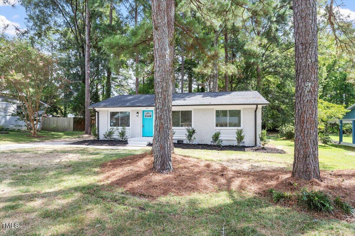 507 Forest Ridge Road Garner, NC 27529 - Photo 23 of 33 a front view of a house with a garden
