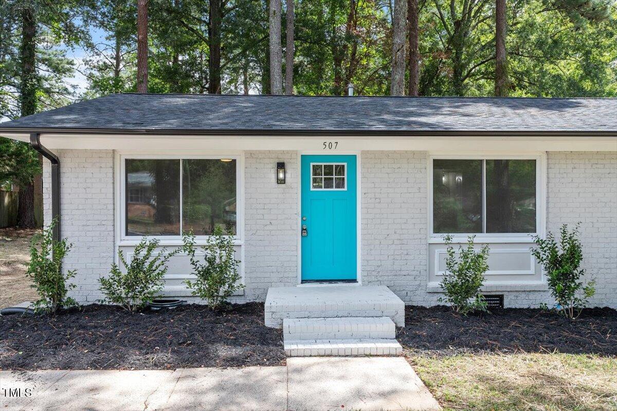 507 Forest Ridge Road Garner, NC 27529 - Photo 27 of 33 a view of a wooden house with a yard