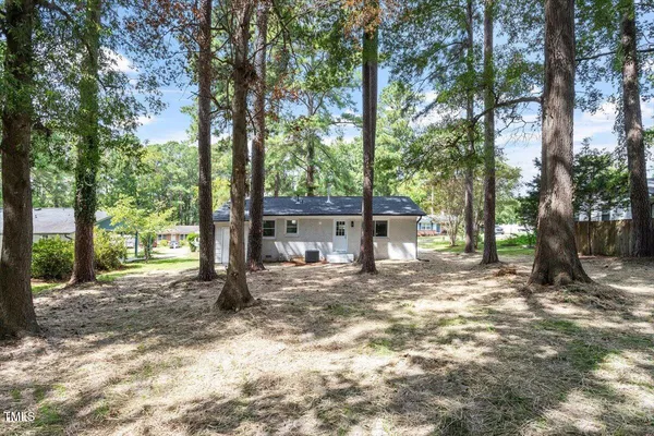 a house with trees in the background
