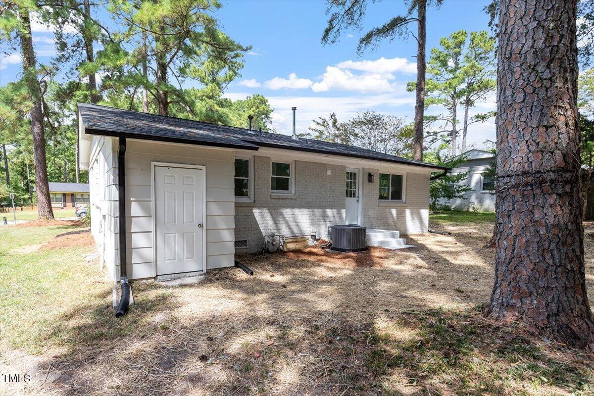 507 Forest Ridge Road Garner, NC 27529 - Photo 30 of 33 a view of a house with backyard porch and sitting area