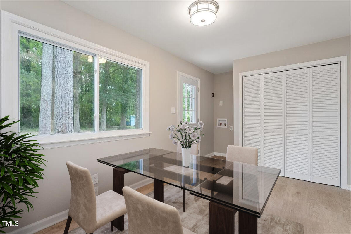 507 Forest Ridge Road Garner, NC 27529 - Photo 8 of 33 a dining room with furniture and wooden floor