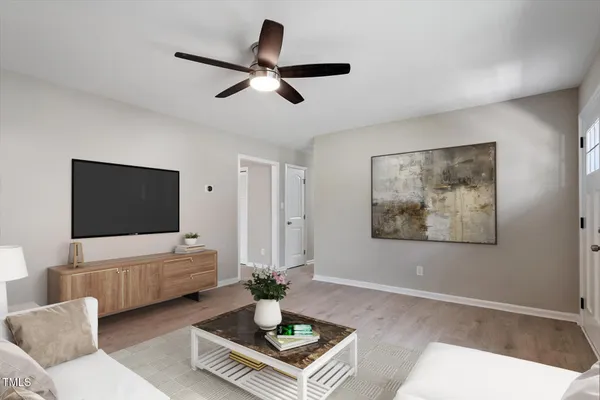 a living room with furniture and a flat screen tv