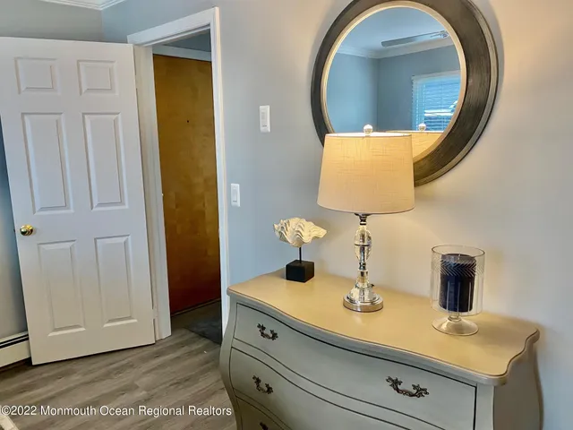 a bathroom with a sink mirror and vanity
