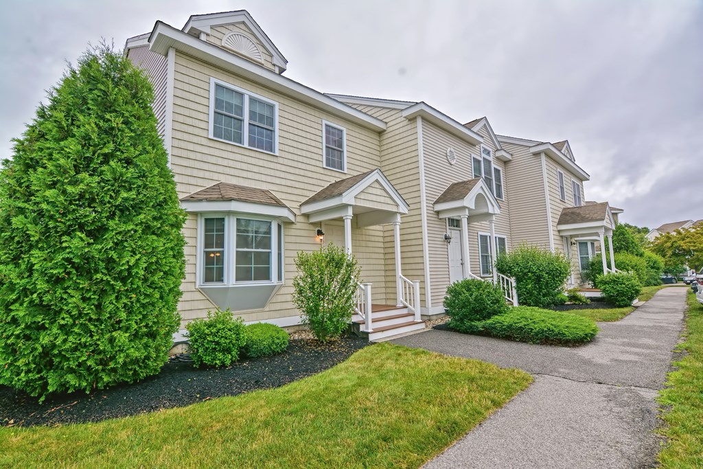 43 Turtle Brook Road, Unit 43 Canton, MA 02021 - Photo 1 of 28 front view of a house with a yard