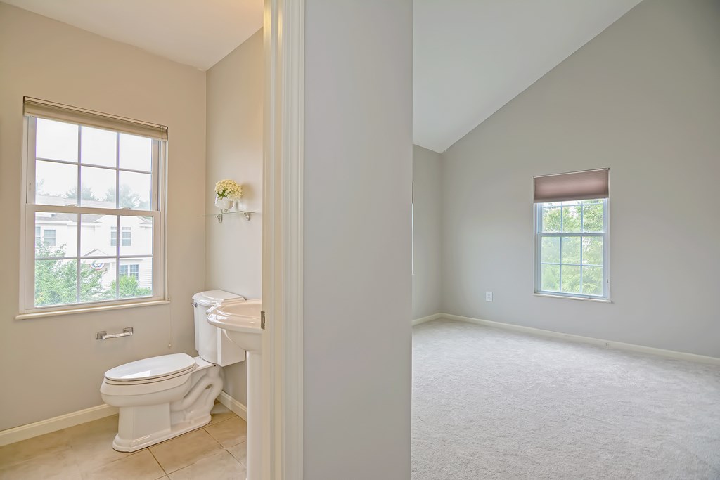 43 Turtle Brook Road, Unit 43 Canton, MA 02021 - Photo 18 of 28 a bathroom with a toilet a sink and a window