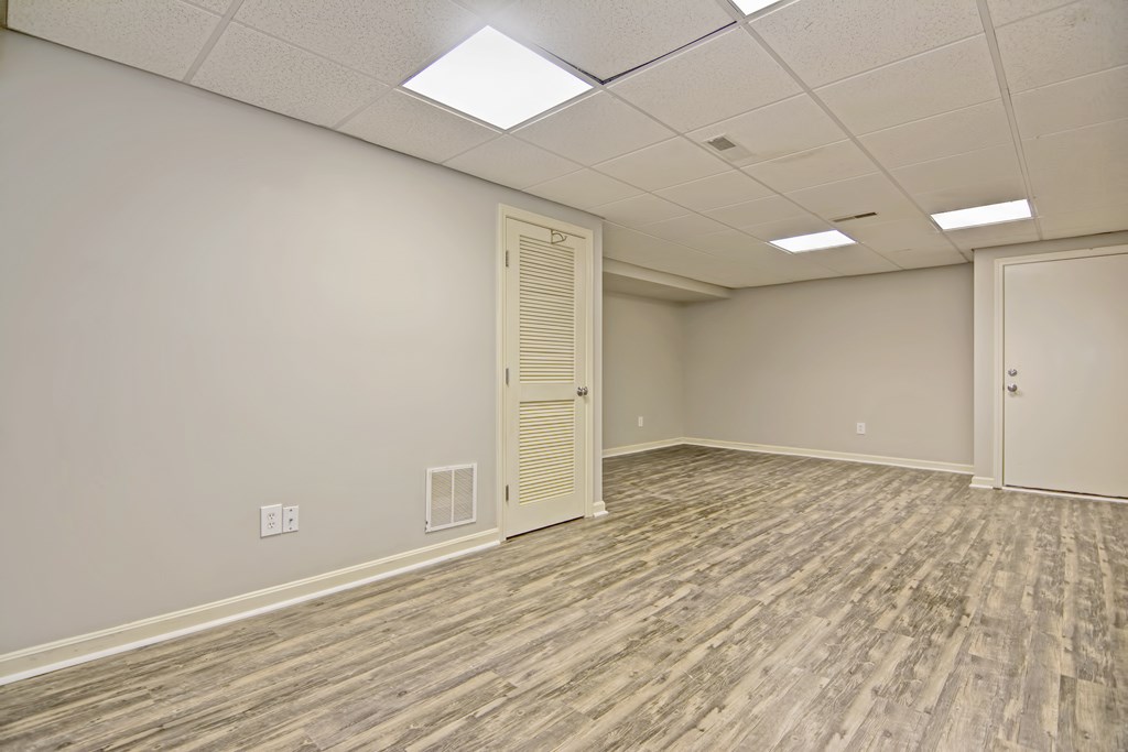 43 Turtle Brook Road, Unit 43 Canton, MA 02021 - Photo 21 of 28 an empty room with wooden floor and white walls