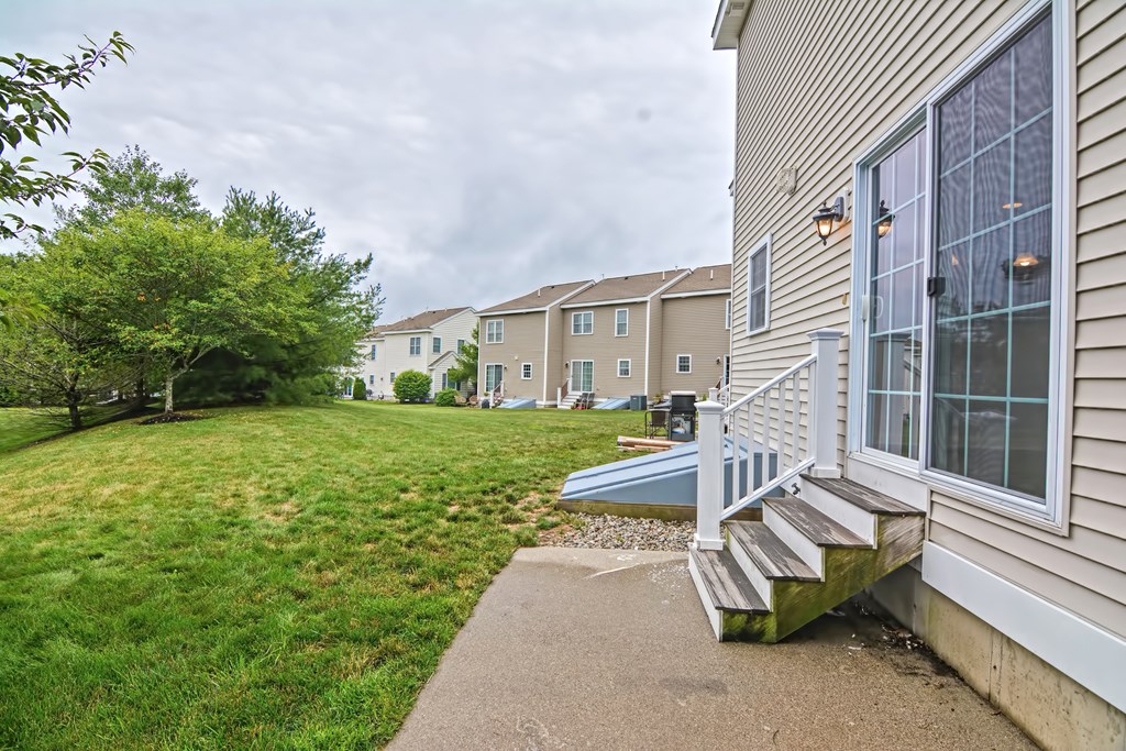 43 Turtle Brook Road, Unit 43 Canton, MA 02021 - Photo 23 of 28 a view of a house with backyard and sitting area