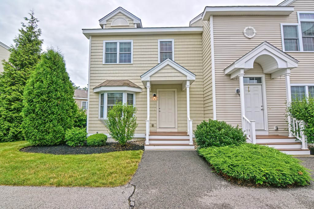 43 Turtle Brook Road, Unit 43 Canton, MA 02021 - Photo 24 of 28 a front view of a house with garden