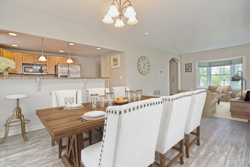 43 Turtle Brook Road, Unit 43 Canton, MA 02021 - Photo 3 of 28 a view of a dining room with furniture and wooden floor