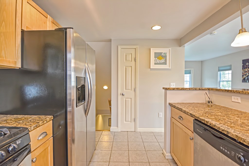 43 Turtle Brook Road, Unit 43 Canton, MA 02021 - Photo 8 of 28 a kitchen with a stove and a refrigerator