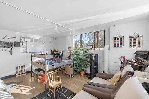 a view of a swimming pool with outdoor seating