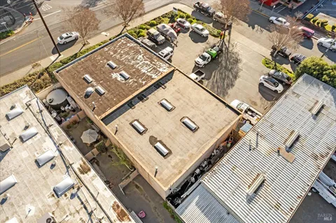an aerial view of residential houses with outdoor space