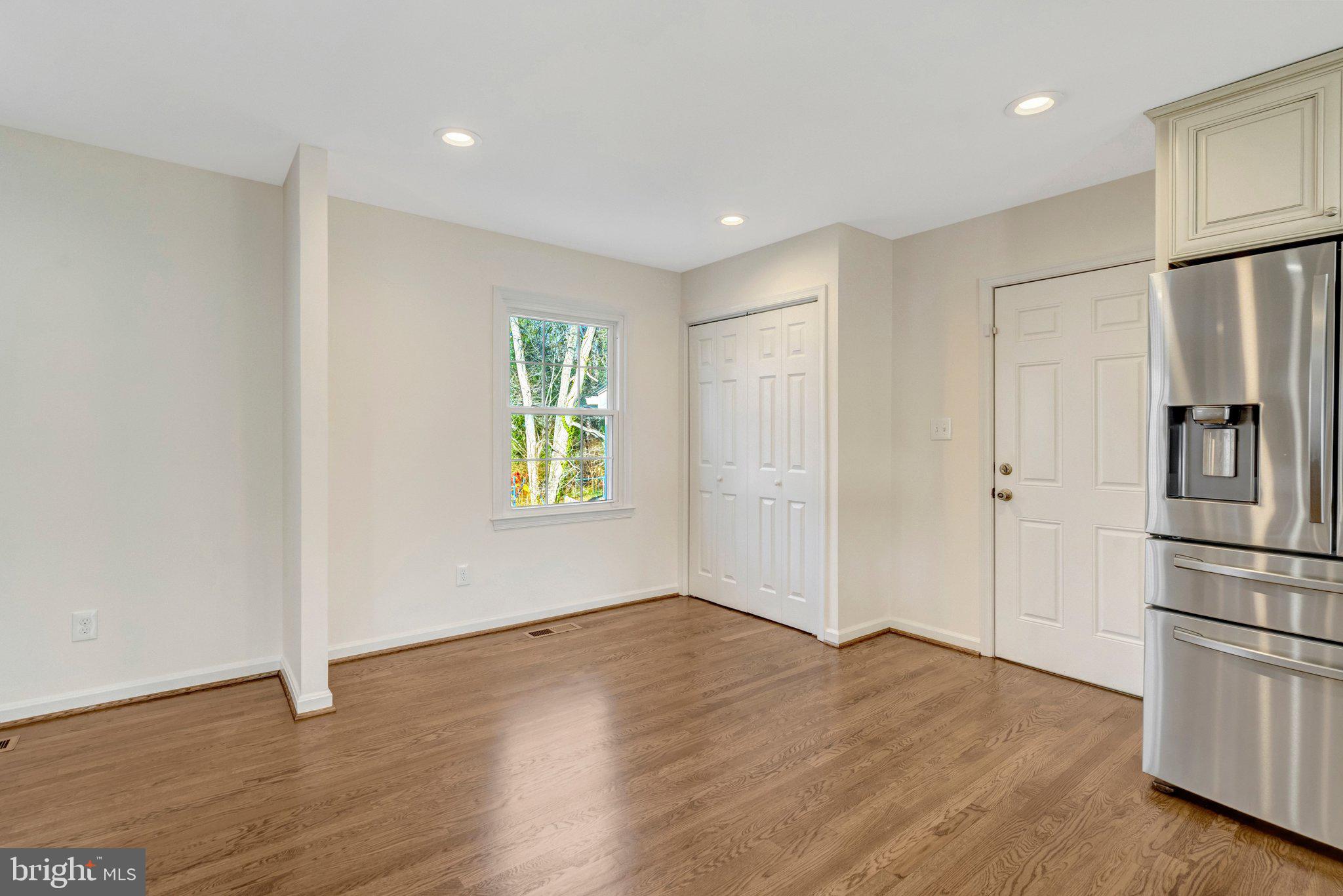 9315 Winbourne Road Burke, VA 22015 - Photo 11 of 51 a view of empty room with wooden floor and window