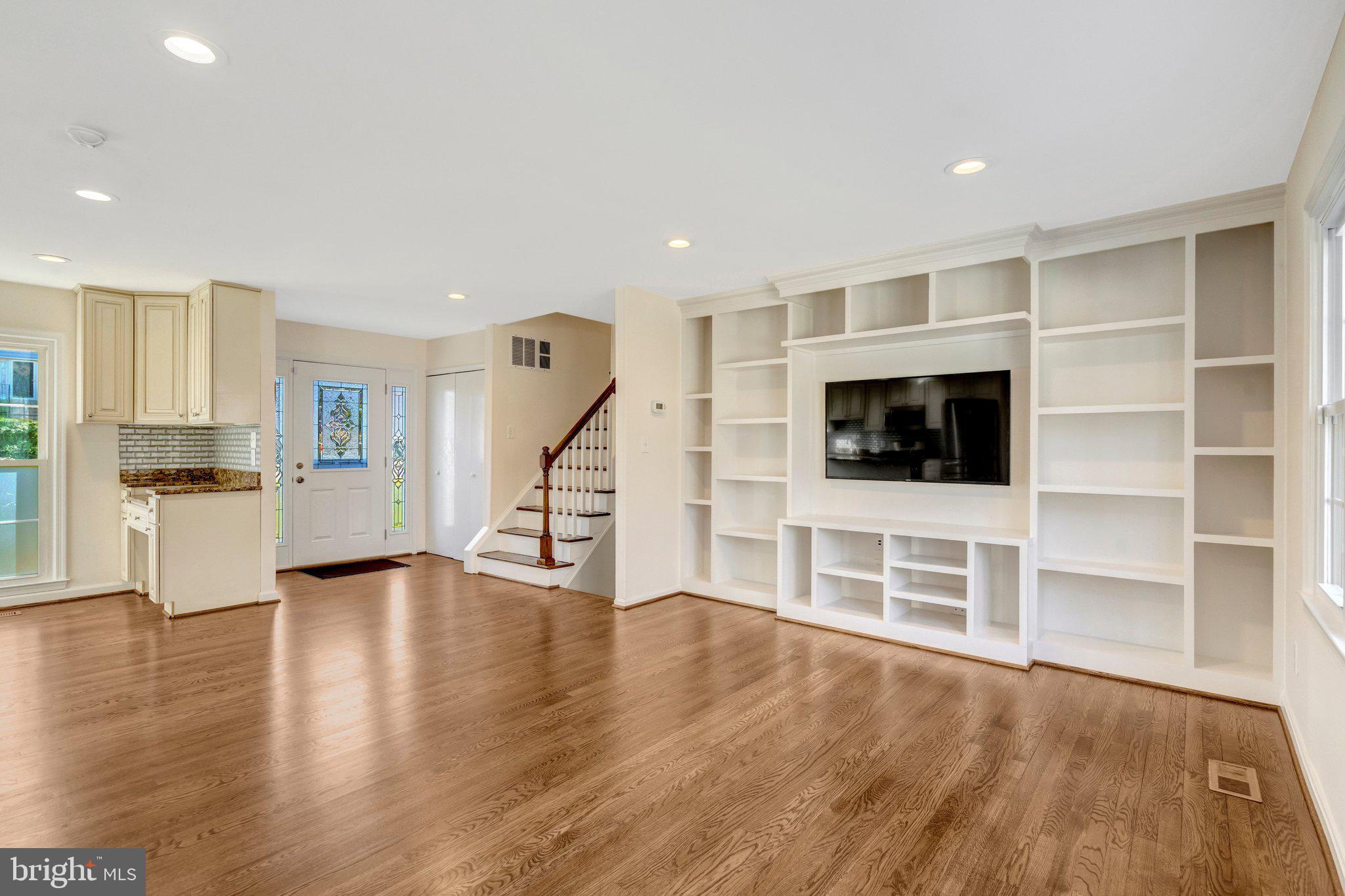9315 Winbourne Road Burke, VA 22015 - Photo 13 of 51 a view of a kitchen with wooden floor and electronic appliances