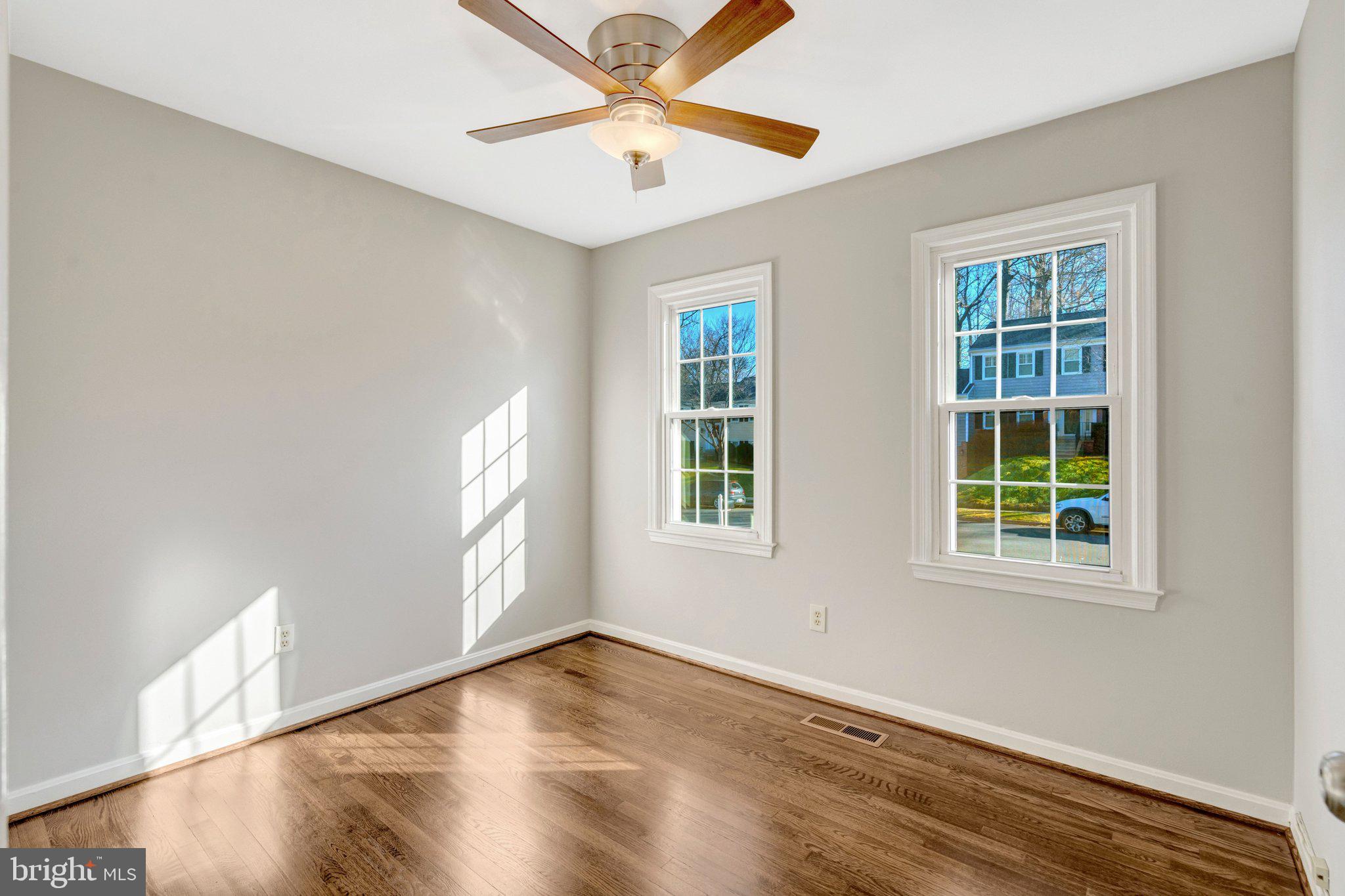 9315 Winbourne Road Burke, VA 22015 - Photo 16 of 51 an empty room with windows and fan