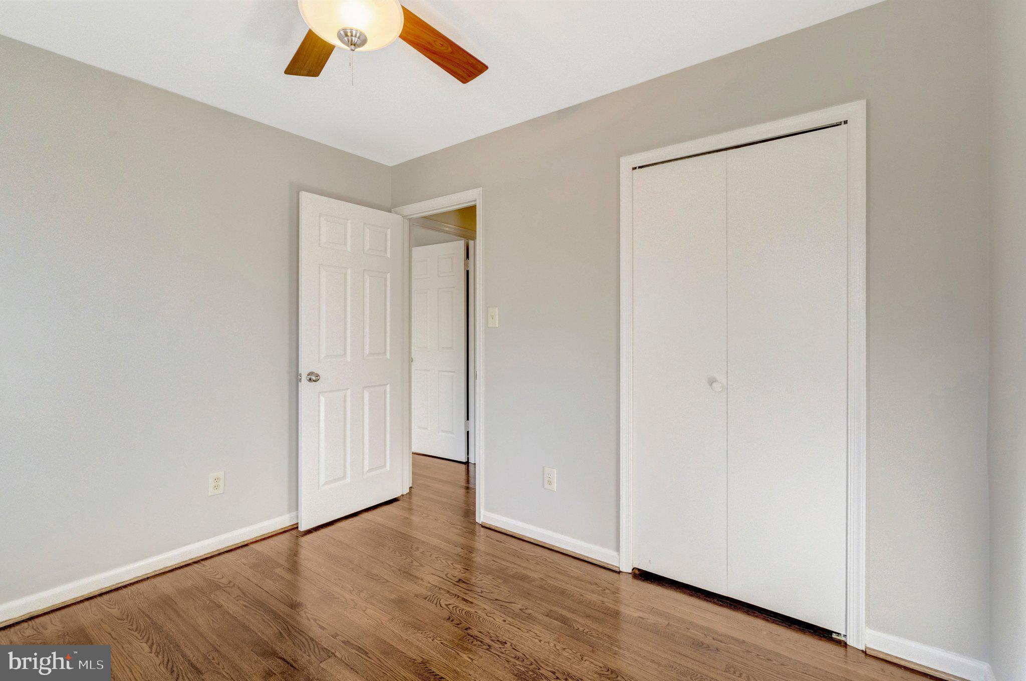 9315 Winbourne Road Burke, VA 22015 - Photo 17 of 51 a view of an empty room with wooden floor