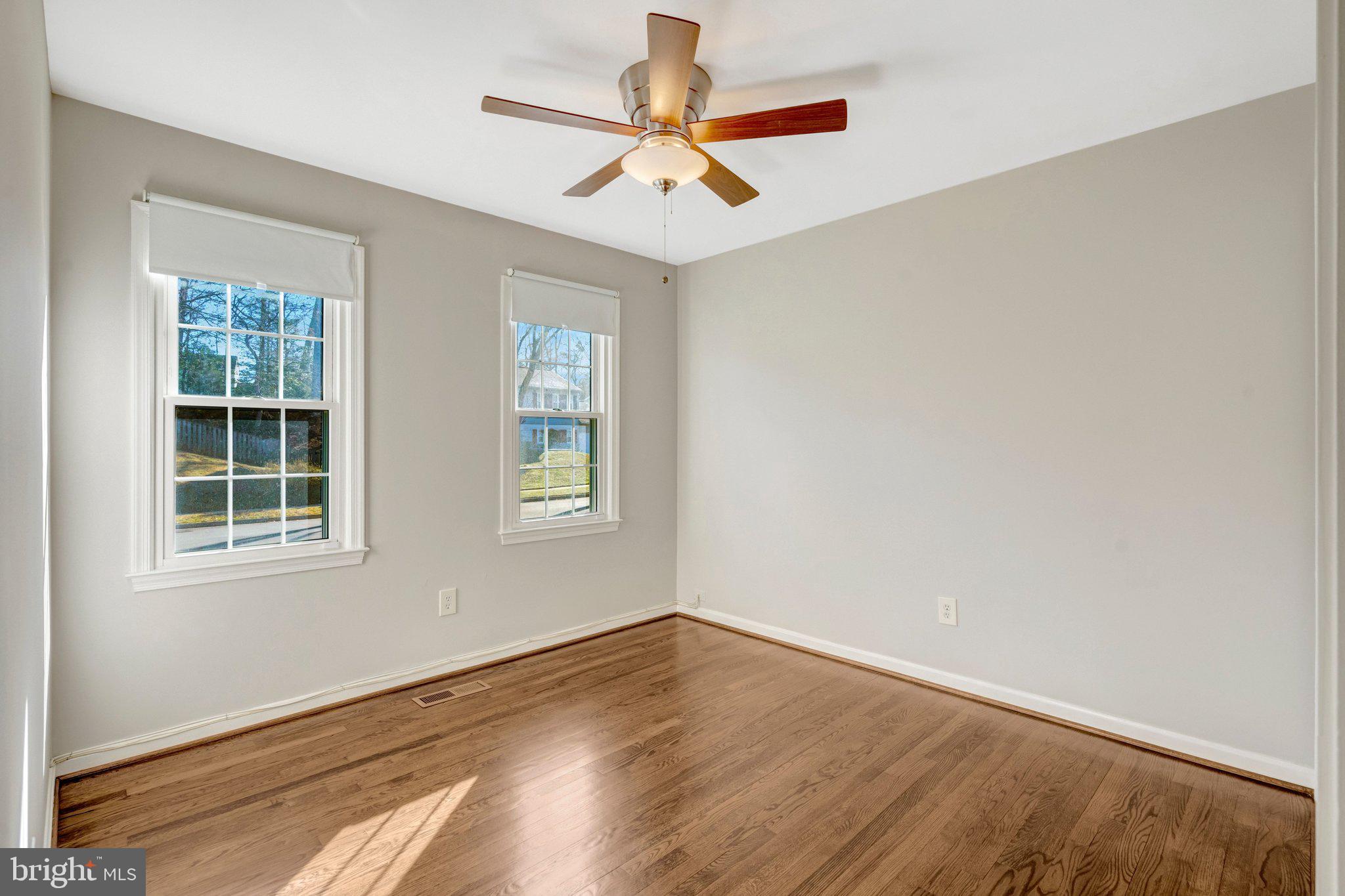 9315 Winbourne Road Burke, VA 22015 - Photo 18 of 51 an empty room with wooden floor and windows