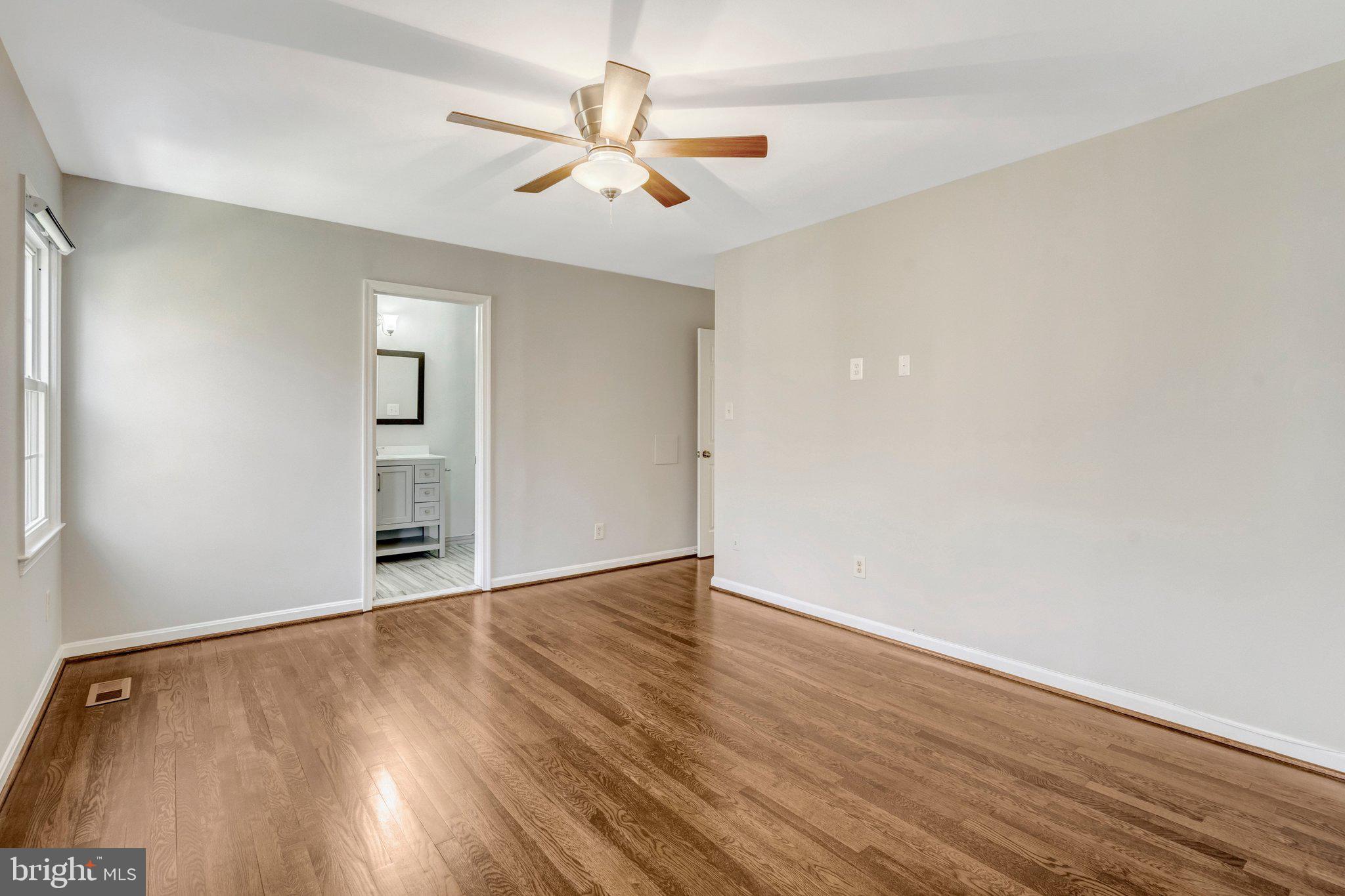 9315 Winbourne Road Burke, VA 22015 - Photo 25 of 51 wooden floor in an empty room with a window