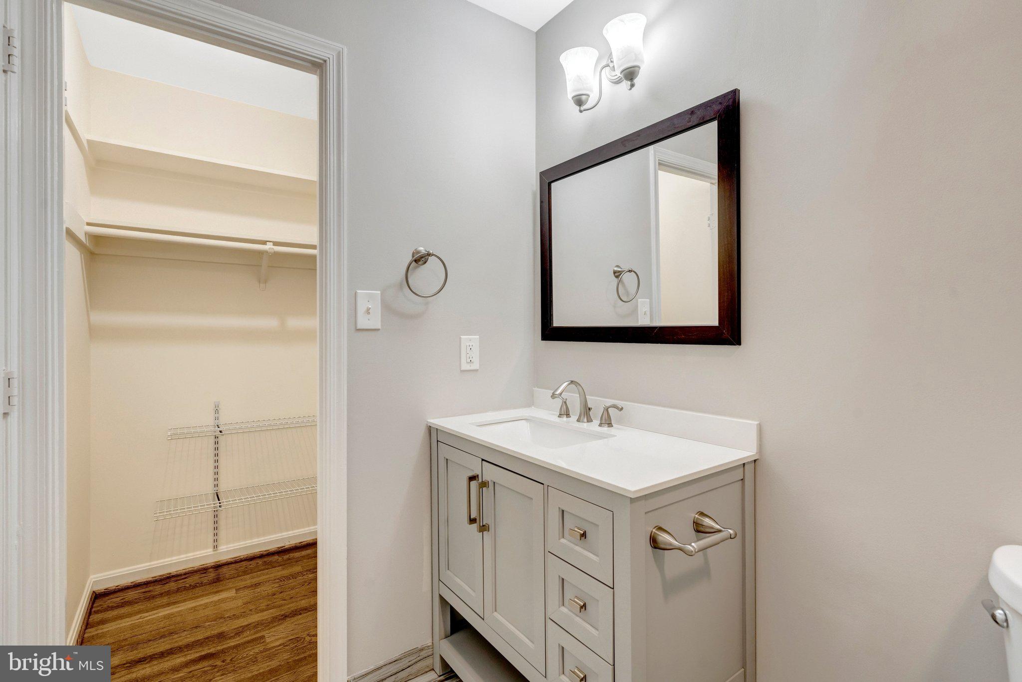 9315 Winbourne Road Burke, VA 22015 - Photo 27 of 51 a bathroom with a toilet sink and mirror