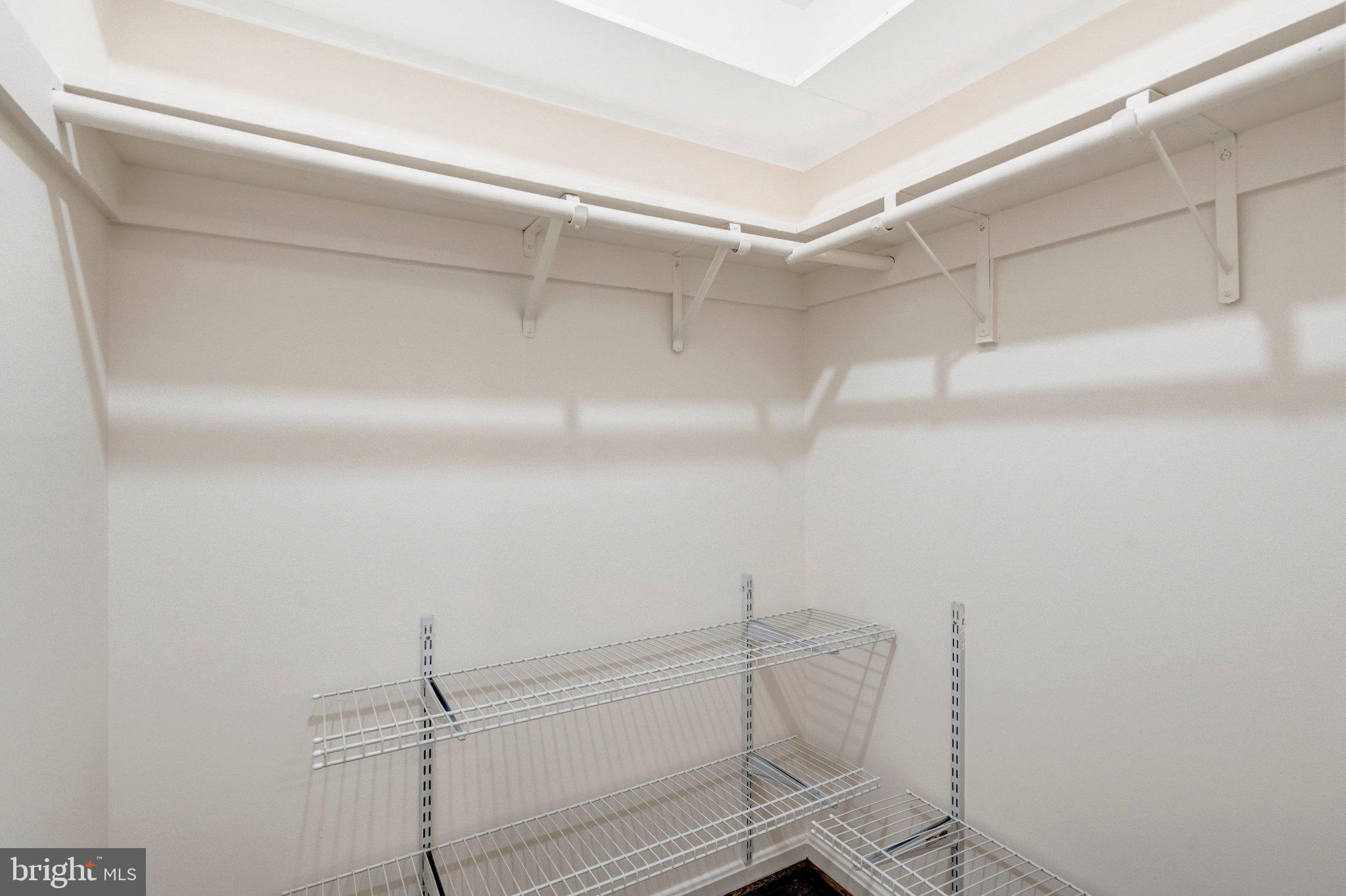 9315 Winbourne Road Burke, VA 22015 - Photo 28 of 51 a view of walk in closet with empty racks
