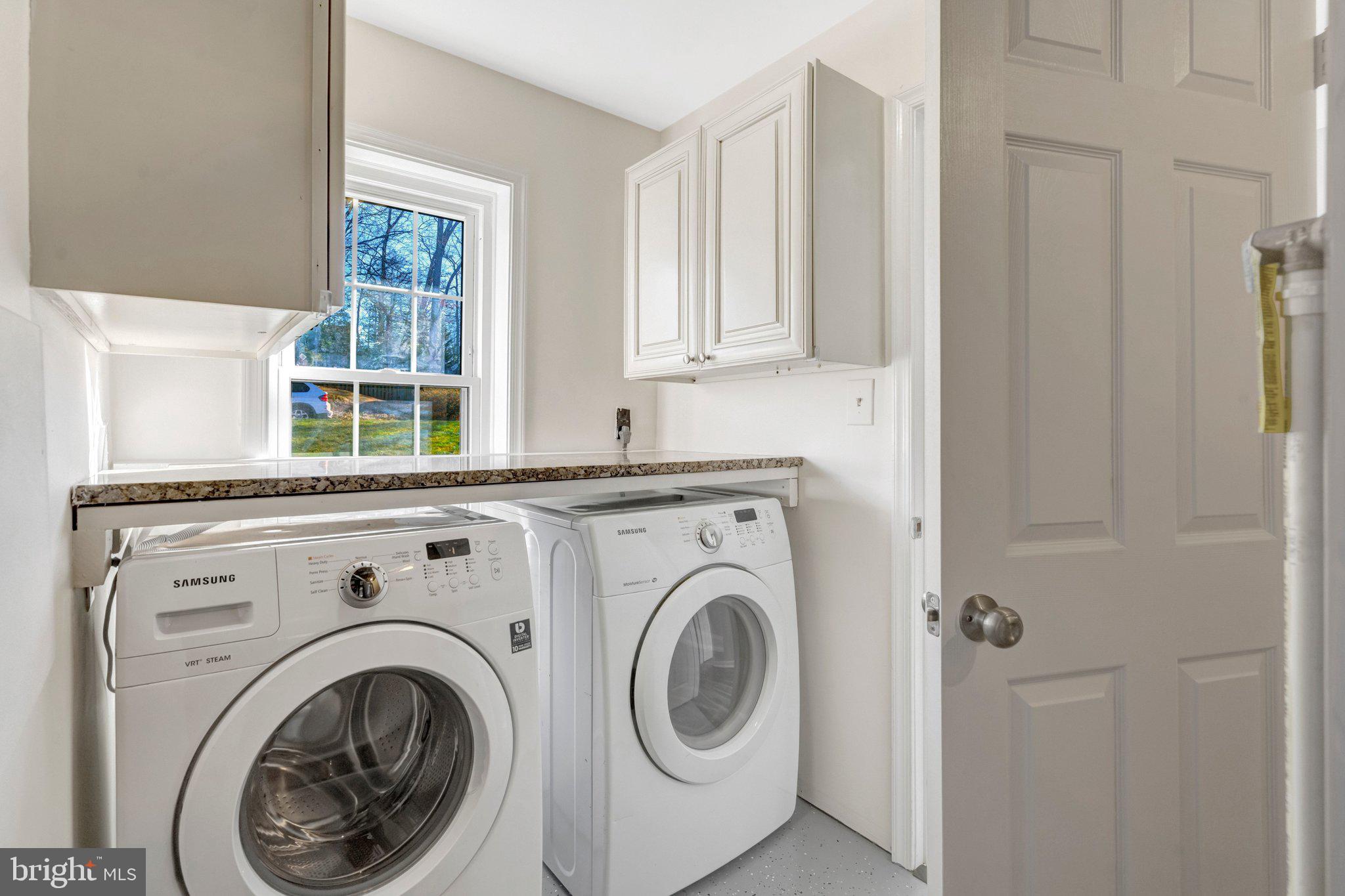 9315 Winbourne Road Burke, VA 22015 - Photo 35 of 51 a view of entryway with washer and dryer