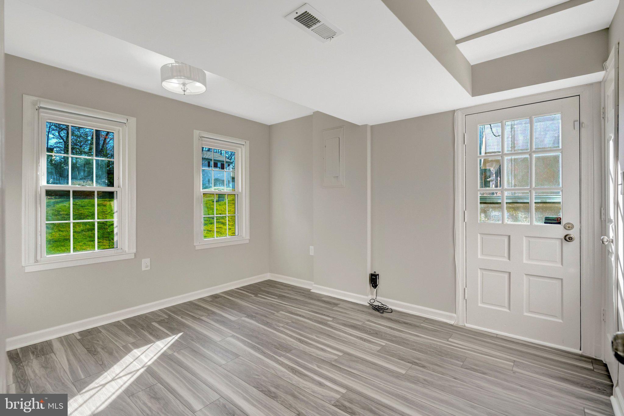 9315 Winbourne Road Burke, VA 22015 - Photo 36 of 51 a view of empty room with wooden floor and fan