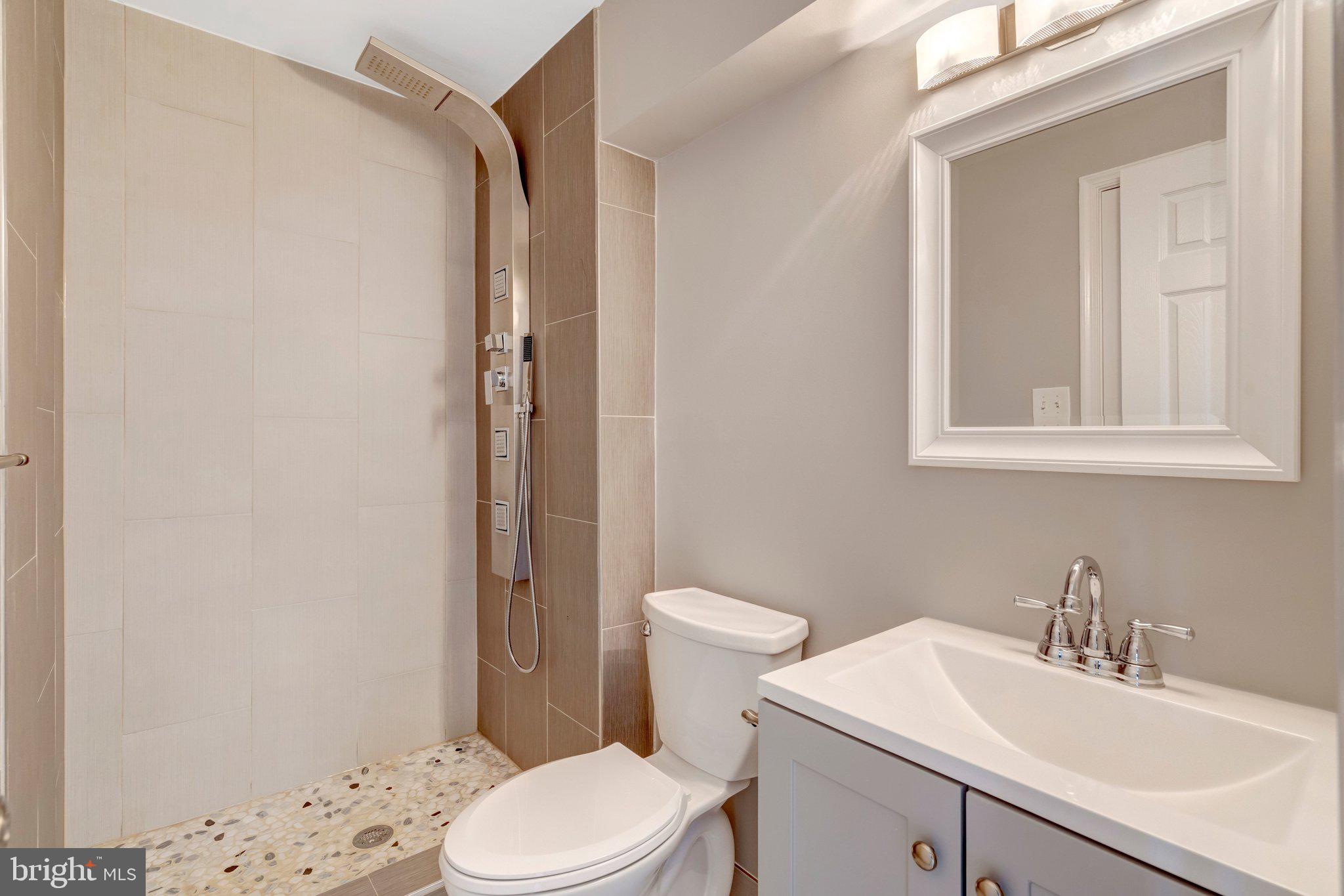 9315 Winbourne Road Burke, VA 22015 - Photo 38 of 51 a bathroom with a sink a toilet and shower