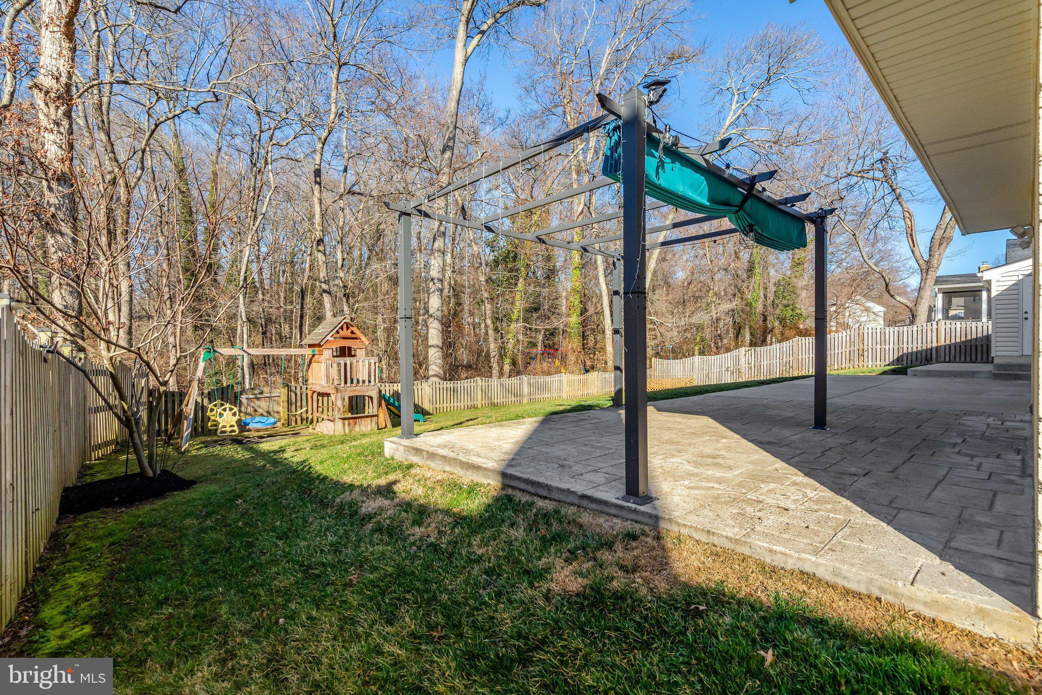 9315 Winbourne Road Burke, VA 22015 - Photo 44 of 51 a view of a house with backyard