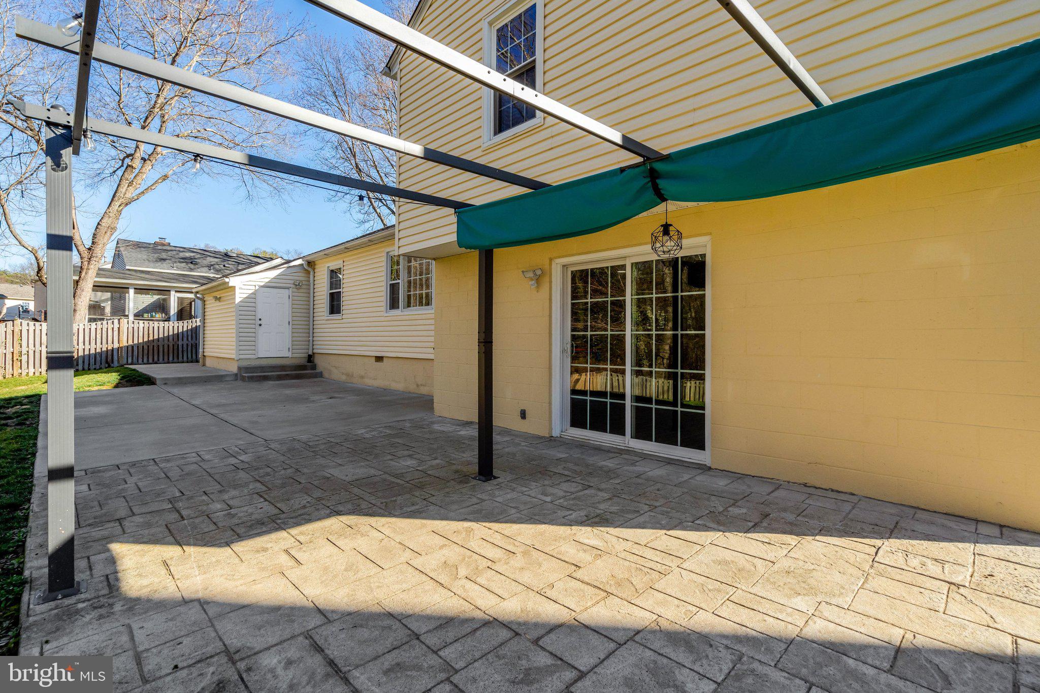 9315 Winbourne Road Burke, VA 22015 - Photo 45 of 51 a view of a house with a wooden fence