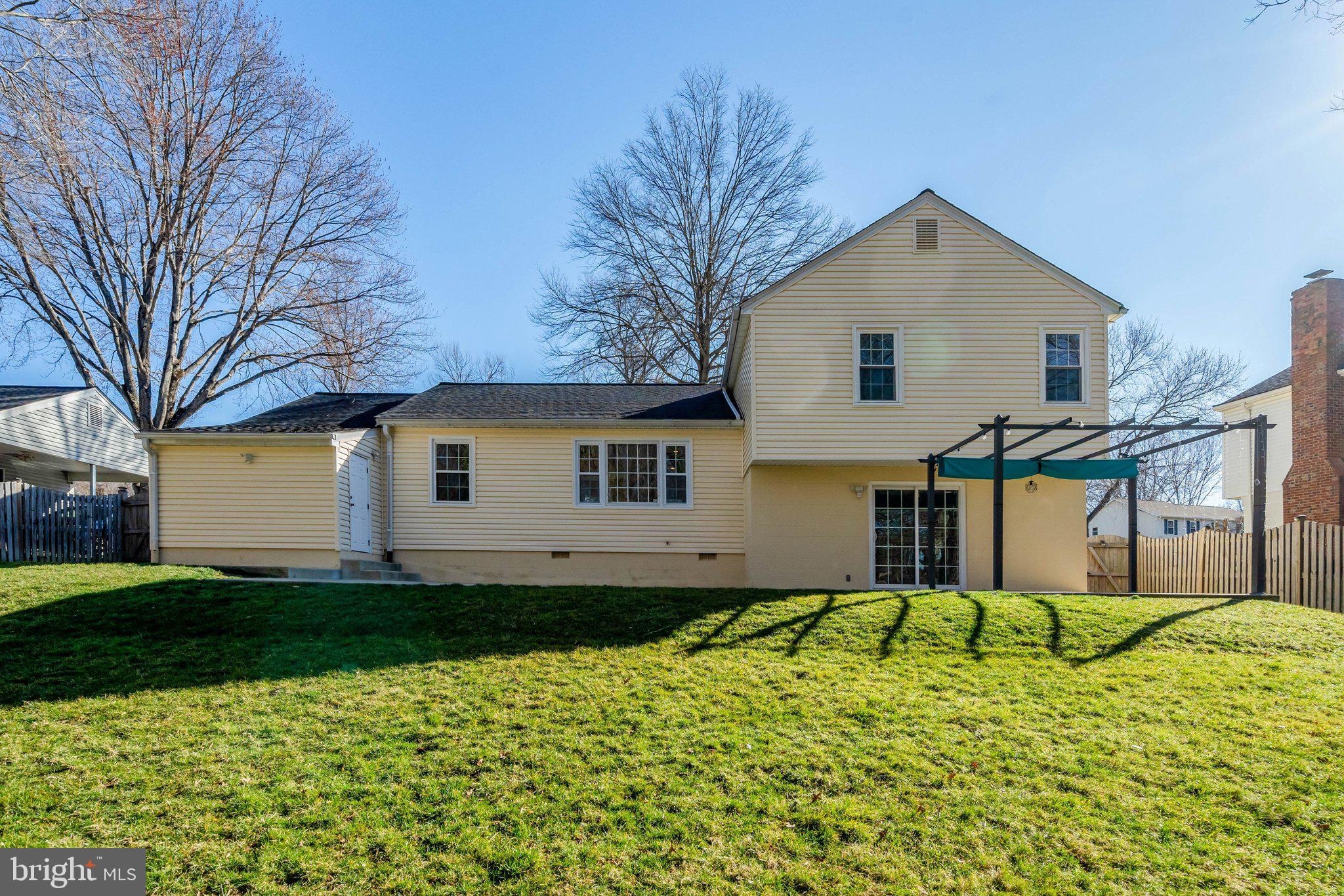 9315 Winbourne Road Burke, VA 22015 - Photo 48 of 51 a view of a house with a yard