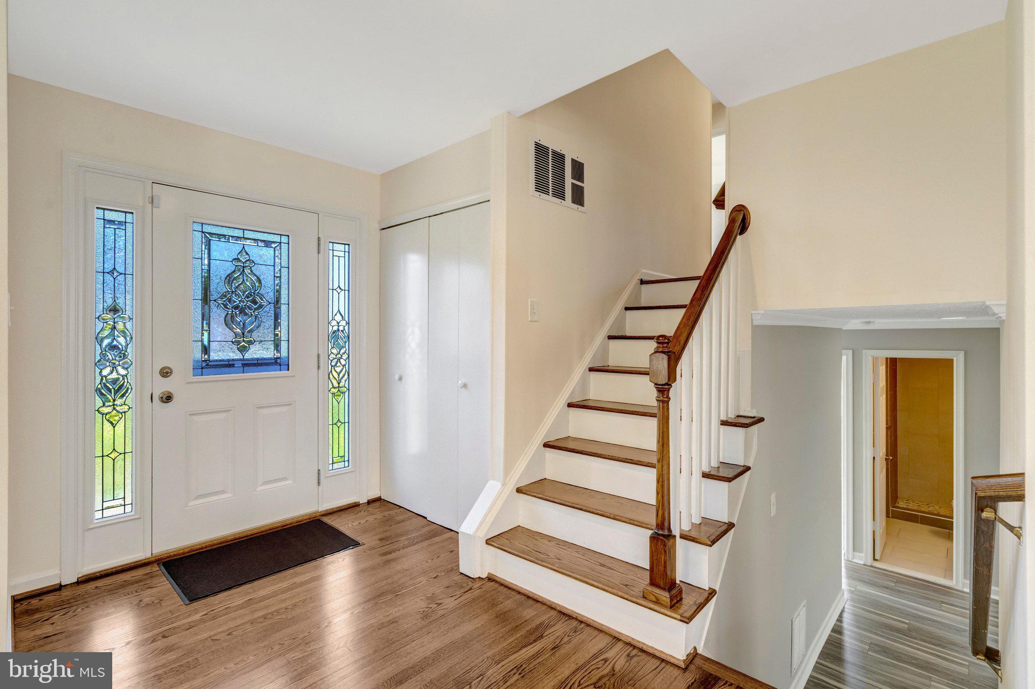 9315 Winbourne Road Burke, VA 22015 - Photo 5 of 51 a view of entryway with wooden floor and stairs