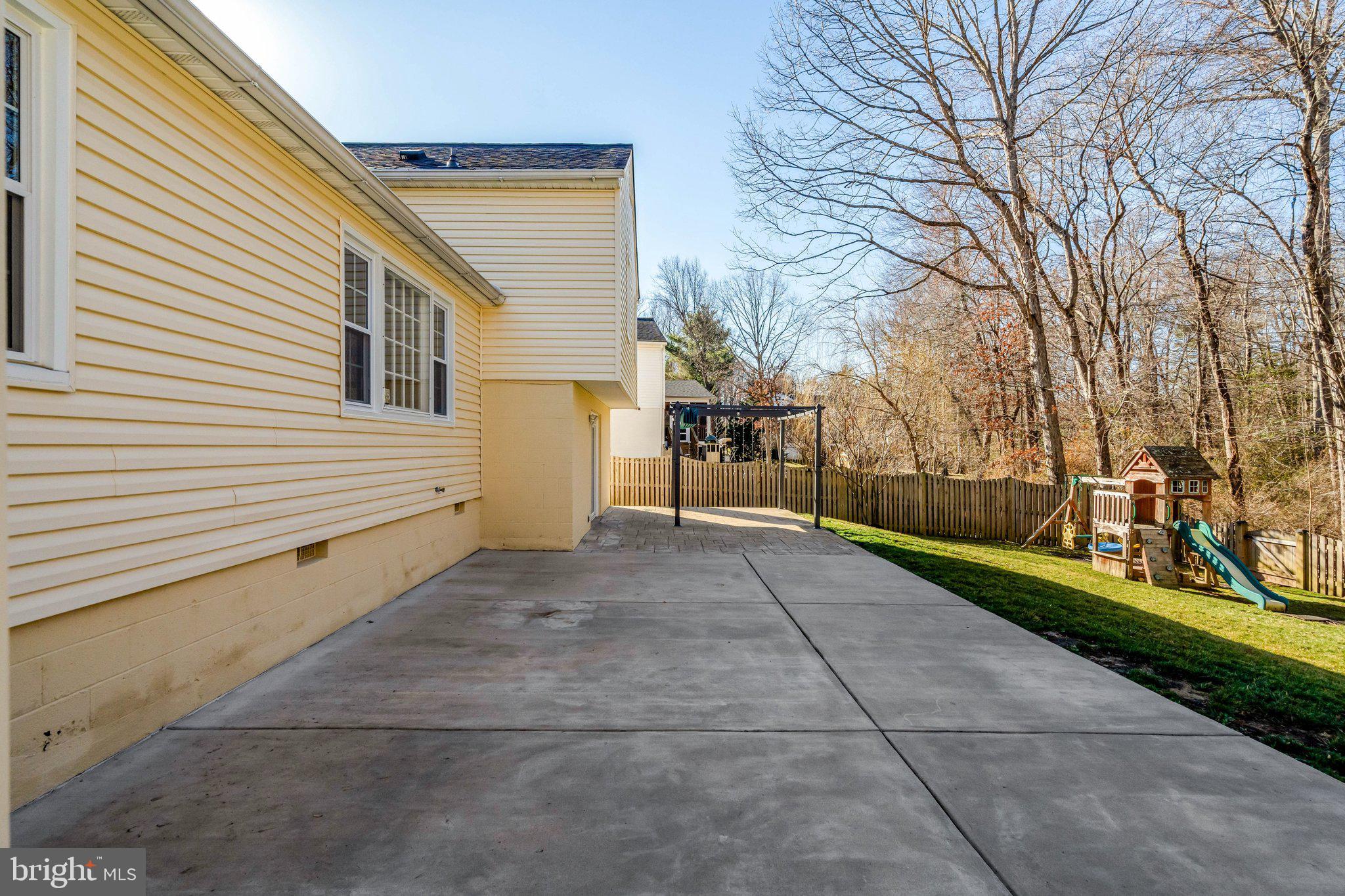 9315 Winbourne Road Burke, VA 22015 - Photo 51 of 51 a view of a patio with a yard