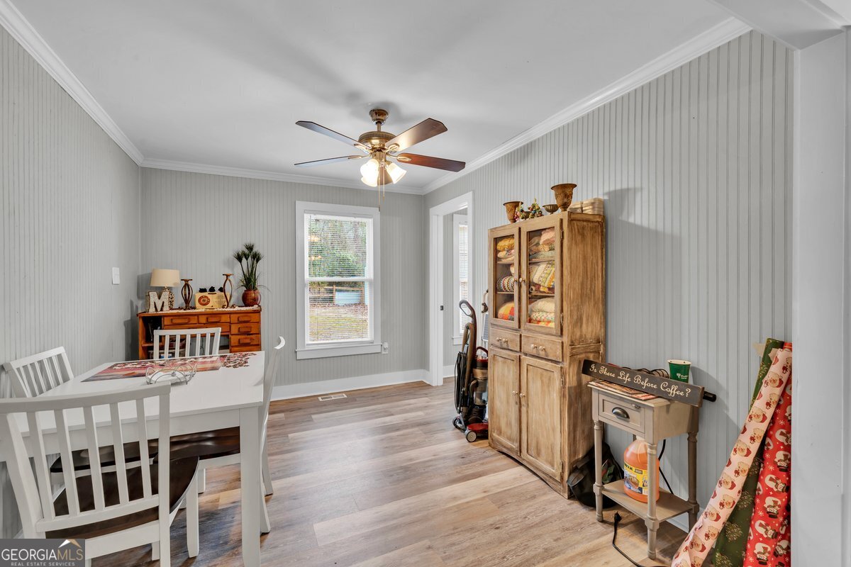 418 Flintside Drive Cobb, GA 31735 - Photo 15 of 45 a view of a dining room with furniture window and wooden floor