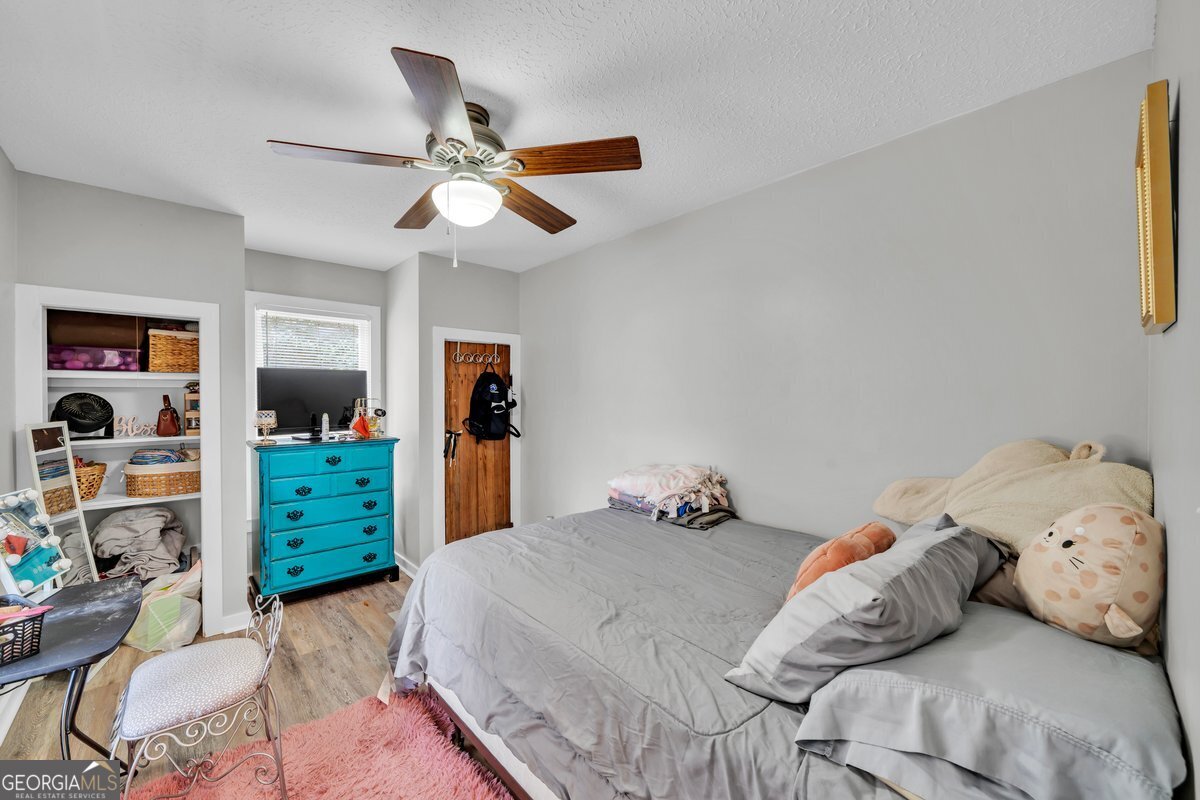 418 Flintside Drive Cobb, GA 31735 - Photo 24 of 45 a bedroom with a bed and a window