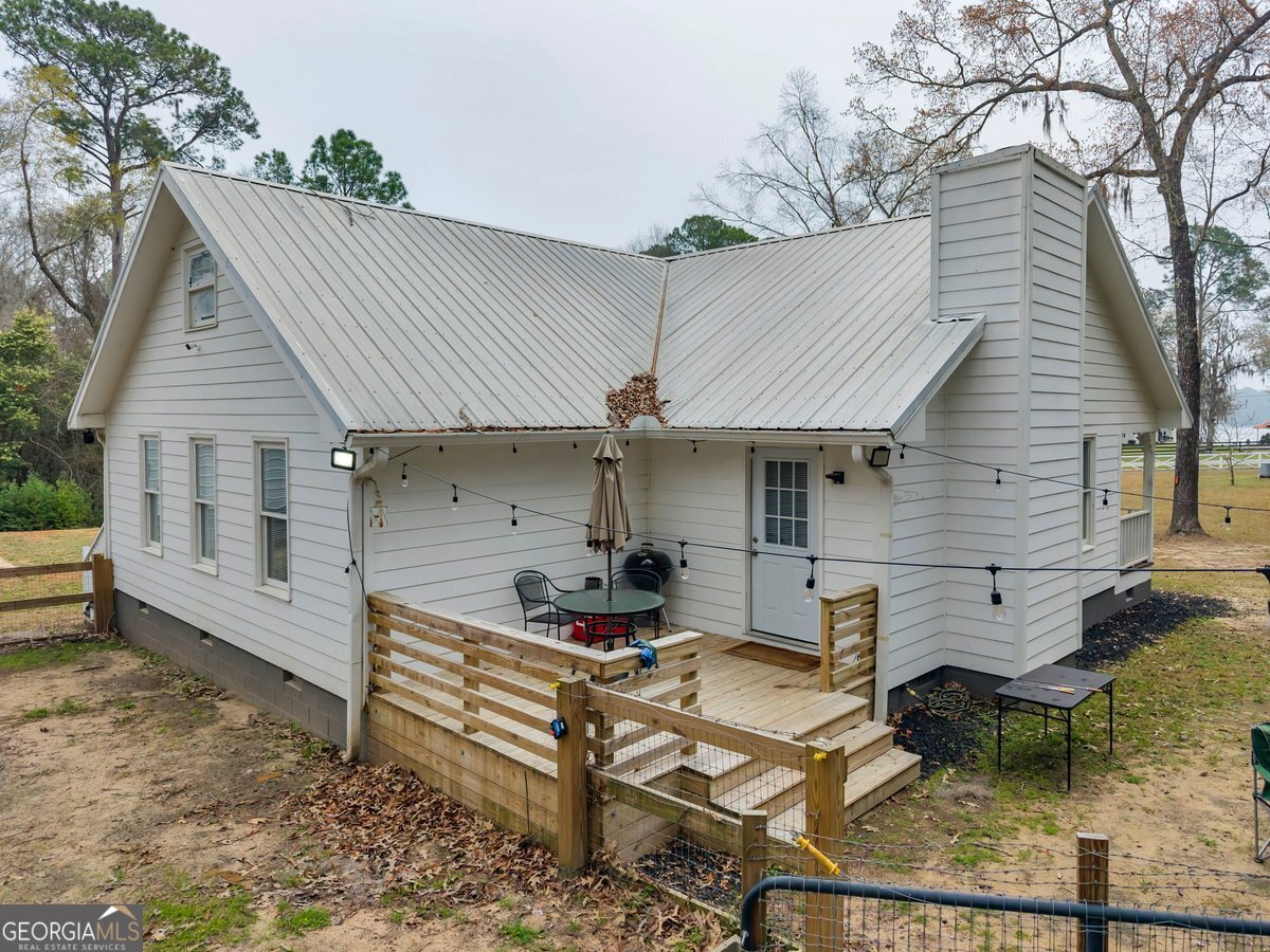 418 Flintside Drive Cobb, GA 31735 - Photo 26 of 45 a view of house with backyard and sitting area