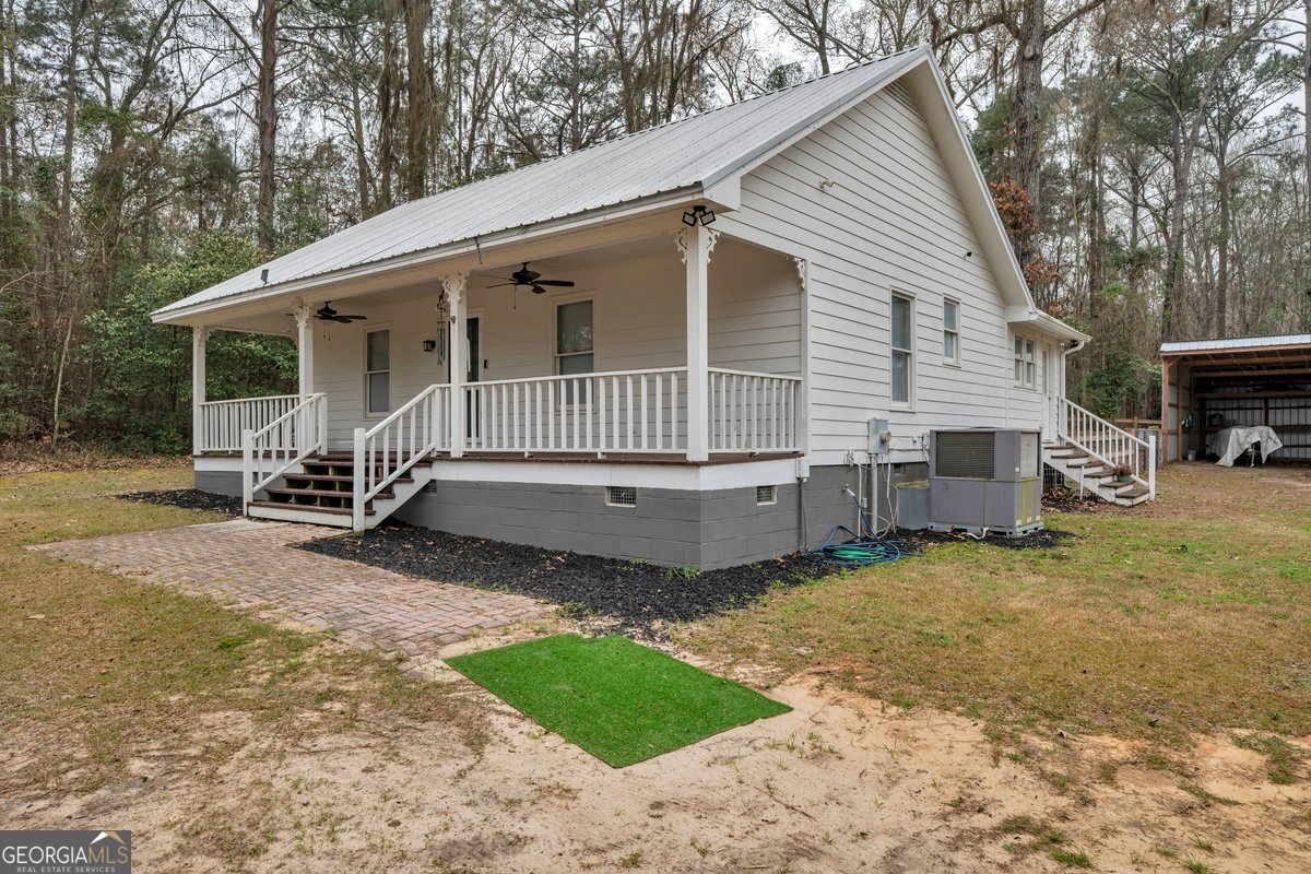 418 Flintside Drive Cobb, GA 31735 - Photo 3 of 45 a view of a house with a yard