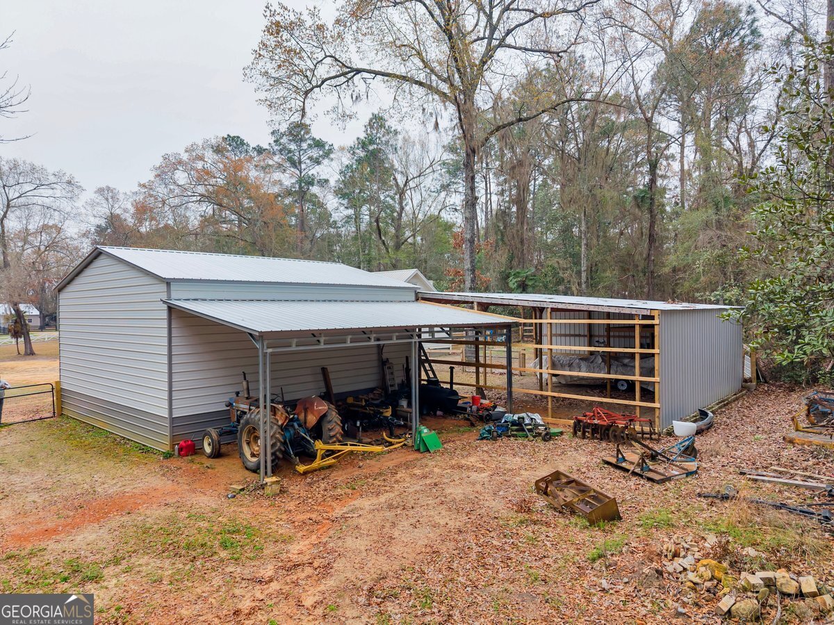 418 Flintside Drive Cobb, GA 31735 - Photo 33 of 45 a view of a backyard with a patio
