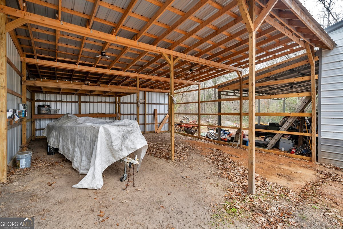 418 Flintside Drive Cobb, GA 31735 - Photo 34 of 45 a view of a big room with wooden walls