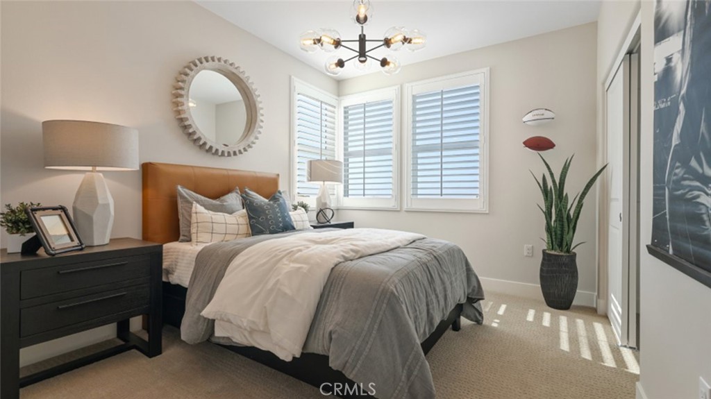 474 Lobata Irvine, CA 92618 - Photo 19 of 43 a bedroom with a bed mirror and window