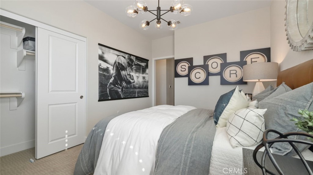 474 Lobata Irvine, CA 92618 - Photo 22 of 43 a bedroom with a bed and painting on the wall