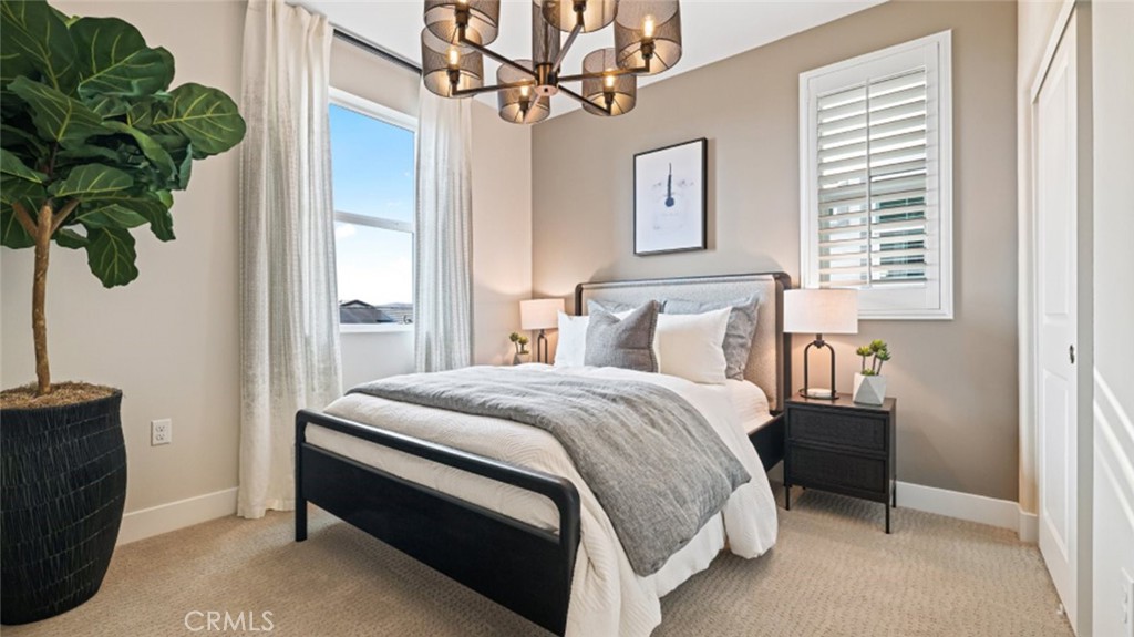 474 Lobata Irvine, CA 92618 - Photo 26 of 43 a bedroom with bed and a window