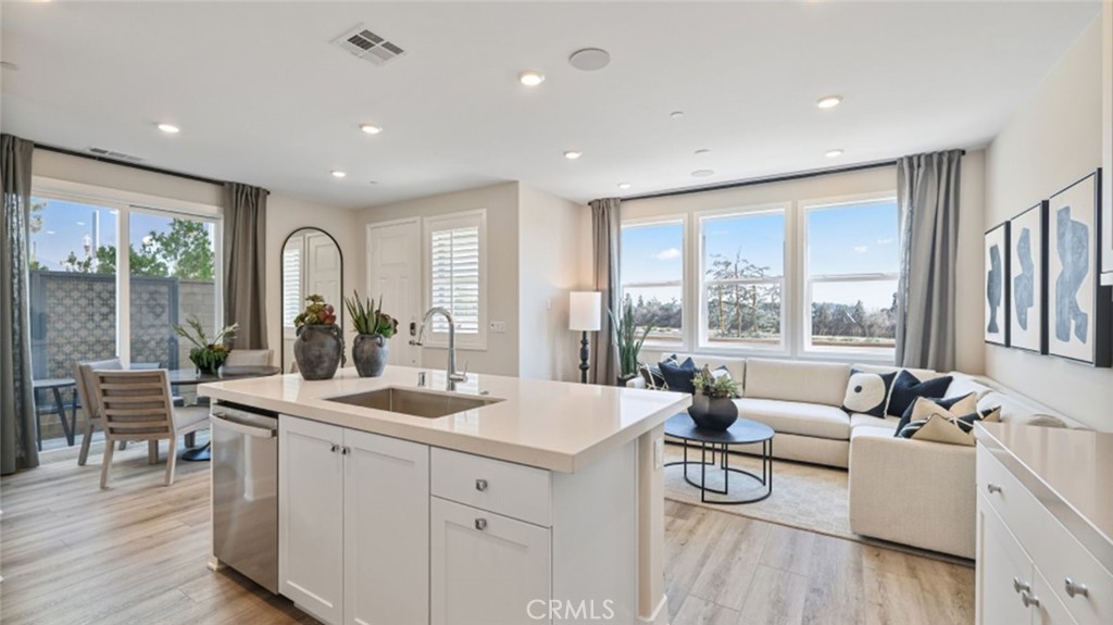 474 Lobata Irvine, CA 92618 - Photo 3 of 43 a living room with furniture and large windows