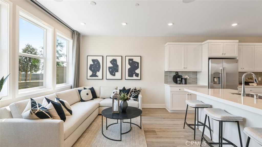 474 Lobata Irvine, CA 92618 - Photo 8 of 43 a living room with furniture and a large window