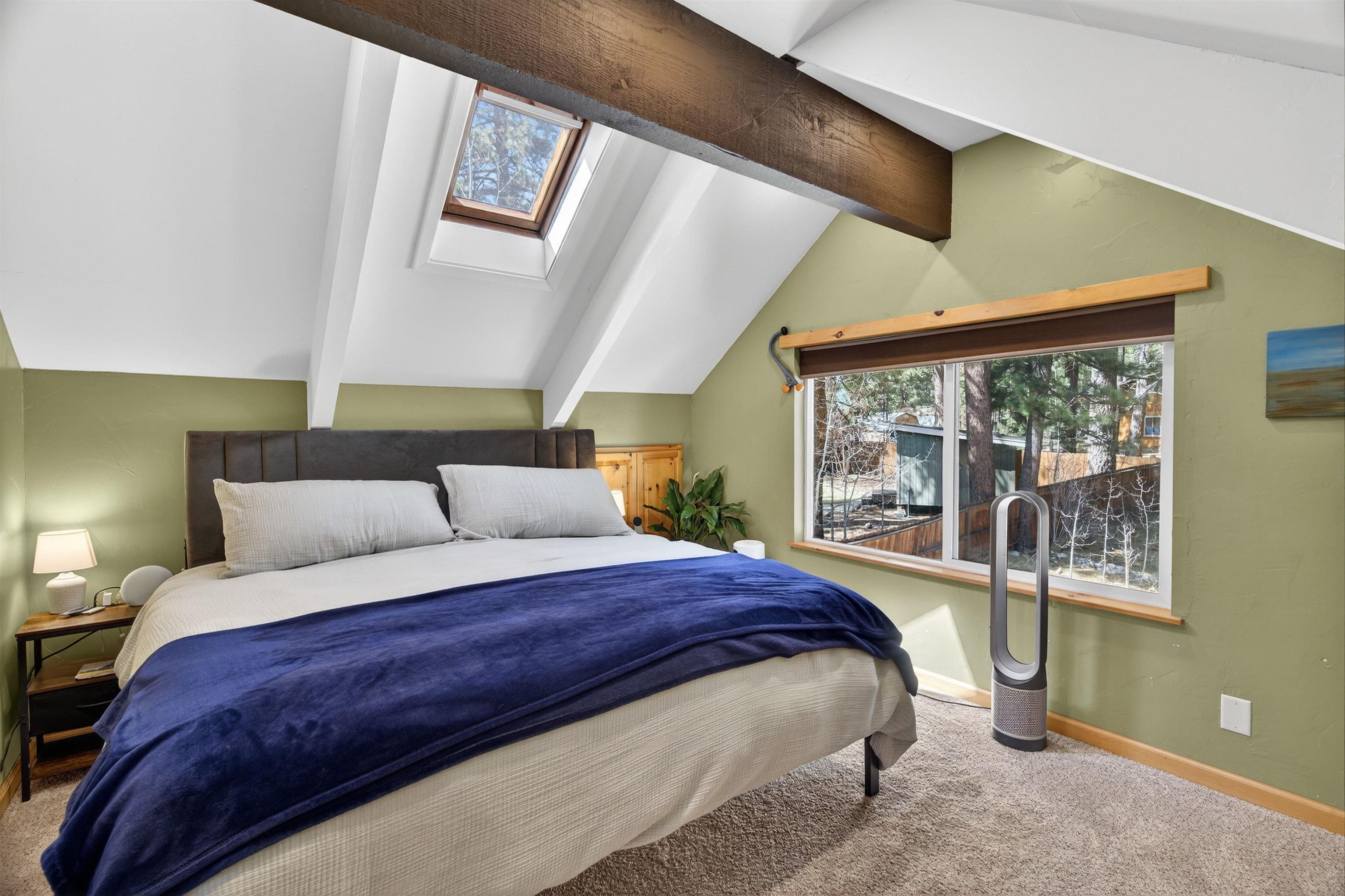 10220 Columbine Road Truckee, CA 96161 - Photo 20 of 28 a bedroom with a large bed and a large window